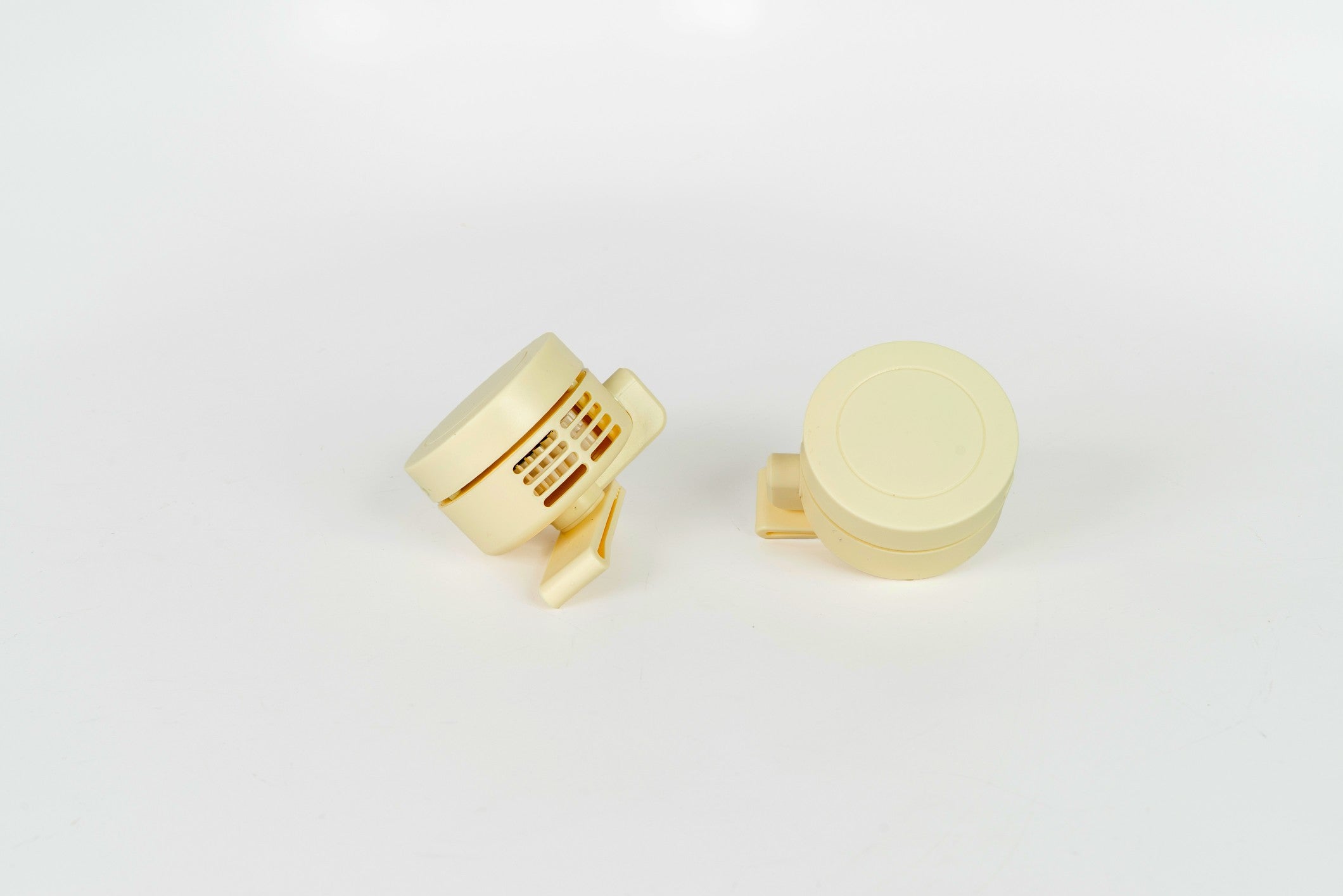 A pair of cream-colored fans.