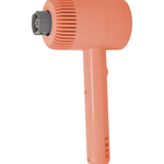 A cordless handheld scrubber in a coral orange color with a ribbed head and a dark gray nozzle for attachments, shown on a solid white background.